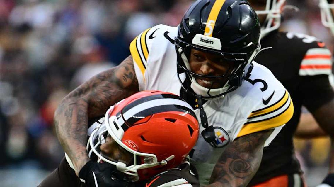  Dec 28, 2025; Cleveland, Ohio, USA; Cleveland Browns quarterback Shedeur Sanders (12) is tackled by Pittsburgh Steelers cornerback Jalen Ramsey (5) in the fourth quarter at Huntington Bank Field. Mandatory Credit: Ken Blaze-Imagn Images | Ken Blaze-Imagn Images 