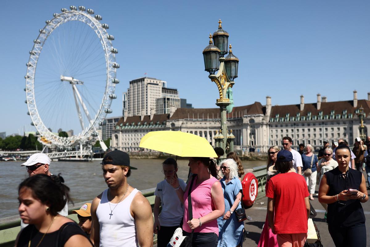 People cross Westminster Bridge in London, Britain, May 26, 2026. REUTERS/Jack Taylor
