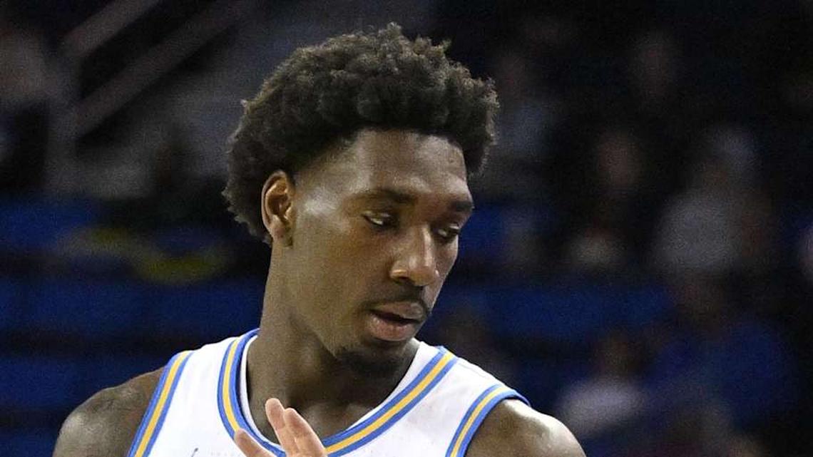  Nov 22, 2024; Los Angeles, California, USA; UCLA Bruins head coach Mick Cronin and guard Eric Dailey Jr. (3) talk during the second half against the Cal State Fullerton Titans at Pauley Pavilion presented by Wescom. Mandatory Credit: Robert Hanashiro-Imagn Images | Robert Hanashiro-Imagn Images 