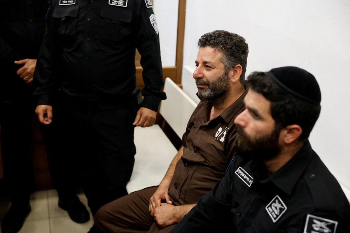 Activist Saif Abu Keshek, a member of the Global Sumud Flotilla detained by Israel, sits at a magistrate's court for a detention extension hearing in Ashkelon, southern Israel, May 3, 2026. REUTERS/Amir Cohen