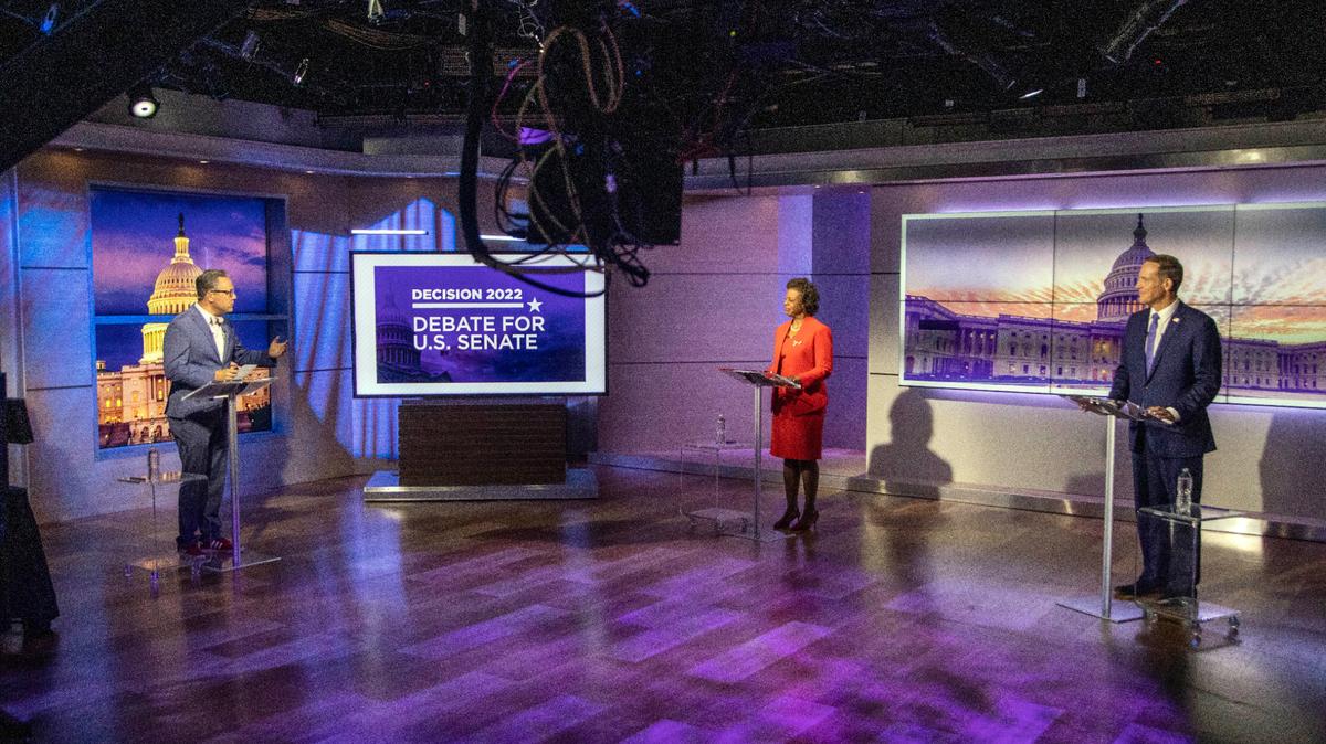 Spectrum News 1 political anchor Tim Boyum, left, moderates a televised debate between Democratic candidate for U.S. Senate Cheri Beasley, center, and Republican challenger U.S. Rep. Ted Budd, R-N.C., Friday, Oct. 7, 2022, at Spectrum News 1 studio in Raleigh, N.C. (Travis Long/The News & Observer via AP, Pool)