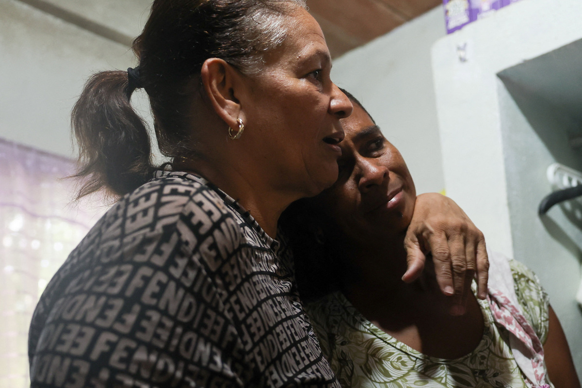 Juana Aiskel Fumero comforts her daughter Aiskely, as they stand in the room of Juana's late daughter, Ashley Martinez, who, along with Juana's granddaughter, Kalani Martinez, was a victim of the June 24 earthquakes, in La Guaira, Venezuela, July 6, 2026. REUTERS/Pablo Sanhueza