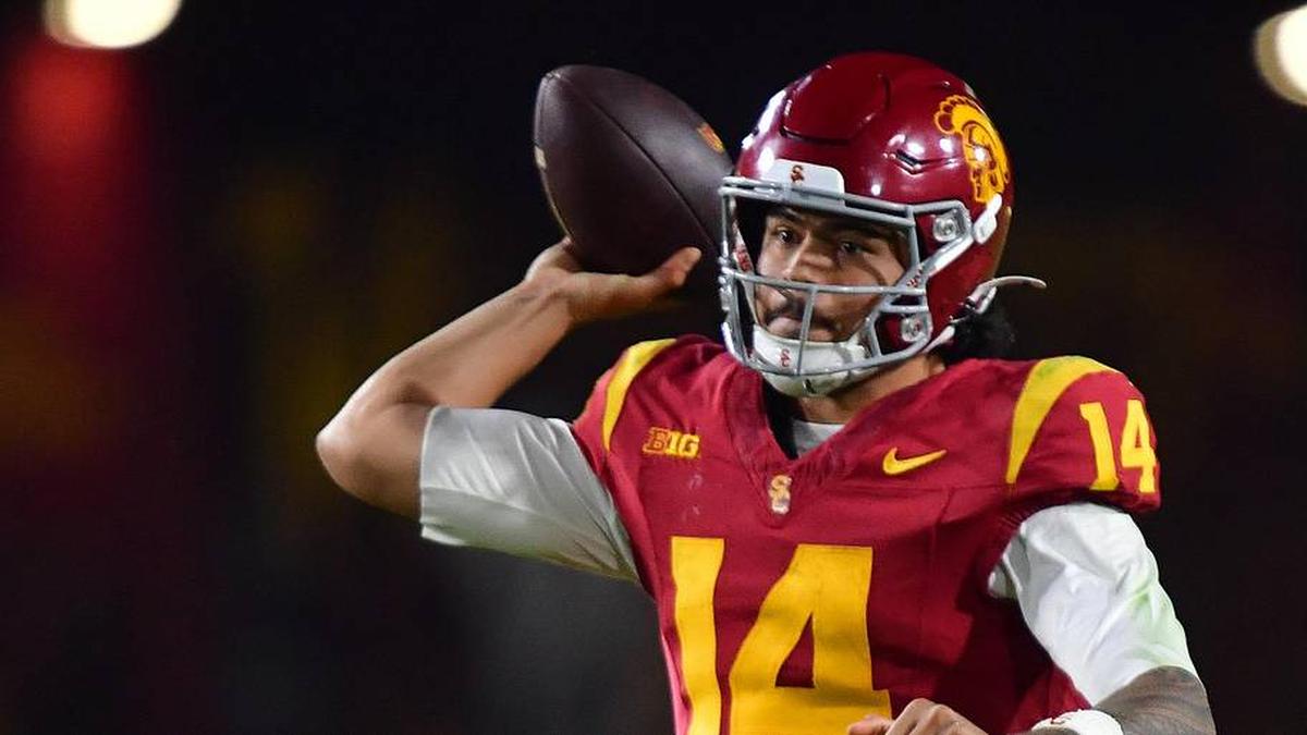  Nov 7, 2025; Los Angeles, California, USA; Southern California Trojans quarterback Jayden Maiava (14) throws against the Northwestern Wildcats during the second half at the Los Angeles Memorial Coliseum. Mandatory Credit: Gary A. Vasquez-Imagn Images | Gary A. Vasquez-Imagn Images 
