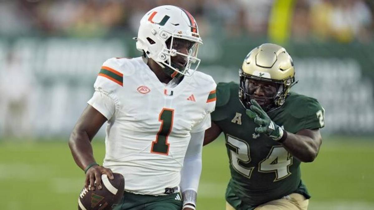  Miami quarterback Cam Ward (1) trots out of bounds during the first half of the Canes' game versus the University of South Florida Bulls on September 21st, 2024 in Tampa, Florida. Mandatory Credit: AP Photo/Chris O'Meara | AP Photo/Chris O'Meara 