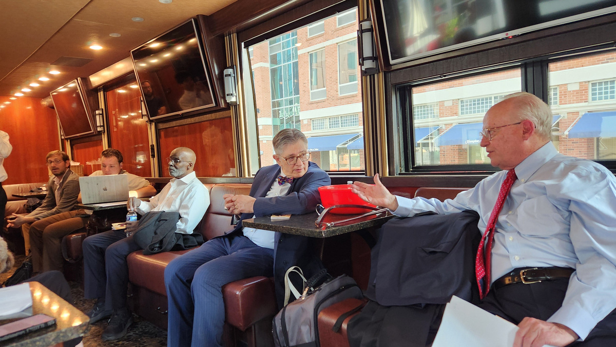 United States Court of International Trade Senior Judge Leo Gordon and former North Carolina Supreme Court Justice Robert Orr talk between stops on the Justice in Motion tour.