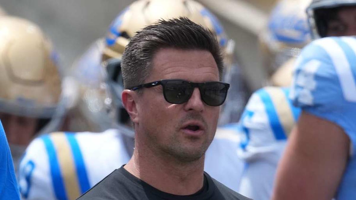  May 2, 2026; Pasadena, CA, USA; UCLA Bruins coach Bob Chesney (left) and son Bob Chesney watch during the spring game at Rose Bowl. Mandatory Credit: Kirby Lee-Imagn Images | Kirby Lee-Imagn Images 