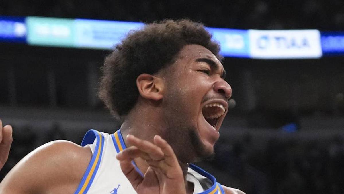  Mar 14, 2026; Chicago, IL, USA; UCLA Bruins guard Brandon Williams (5) reacts after dunking the ball on Purdue Boilermakers guard Braden Smith (3) during the second half at United Center. Mandatory Credit: David Banks-Imagn Images | David Banks-Imagn Images 