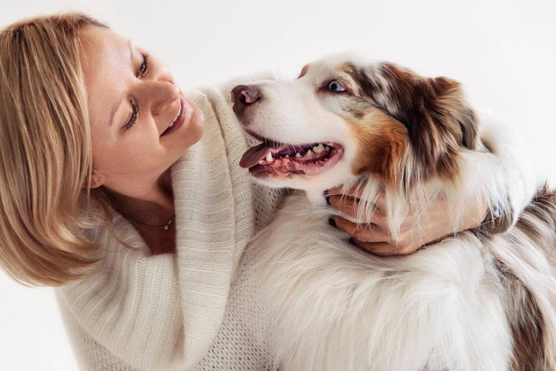  A dog lovingly looking into its owner's eyes. 