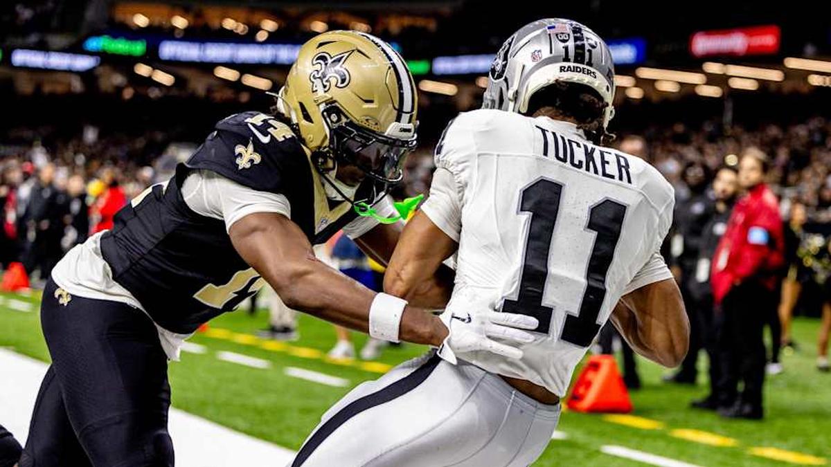  Dec 29, 2024; New Orleans, Louisiana, USA; Las Vegas Raiders wide receiver Tre Tucker (11) catches a touchdown pass against New Orleans Saints cornerback Kool-Aid McKinstry (14) during the second half at Caesars Superdome. Mandatory Credit: Stephen Lew-Imagn Images | Stephen Lew-Imagn Images 