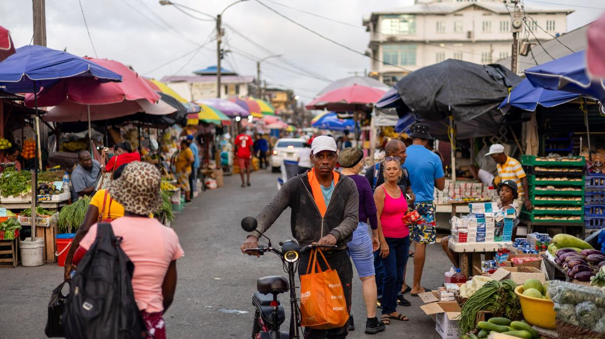 Shoppers walk through the downtown Bourda Market, as Guyana's fast-growing economy is set to benefit from a reshaped global energy market due to the U.S.-Israeli war on Iran, in Georgetown, Guyana May 9, 2026. REUTERS/Yancey Haywood