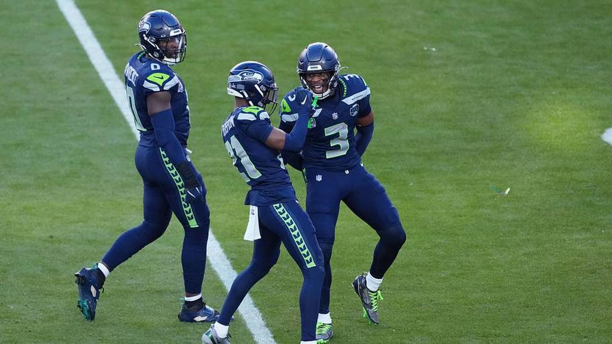  Feb 8, 2026; Santa Clara, CA, USA; Seattle Seahawks cornerback Devon Witherspoon (21) and Seattle Seahawks safety Nick Emmanwori (3) celebrate a stop against the New England Patriots in the first half in Super Bowl LX at Levi's Stadium. Mandatory Credit: Kirby Lee-Imagn Images | Kirby Lee-Imagn Images 