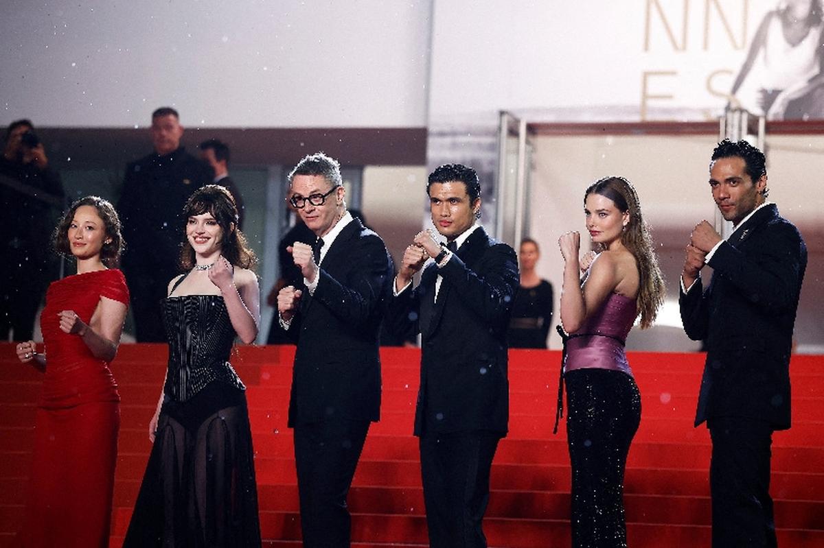 Director Nicolas Winding Refn and cast members Sophie Thatcher, Diego Calva, Kristine Froseth, Charles Melton and Havana Rose Liu pose on the red carpet during arrivals for the screening of the film "Her Private Hell" Out of competition at the 79th Cannes Film Festival in Cannes, France, May 18, 2026. REUTERS/Sarah Meyssonnier