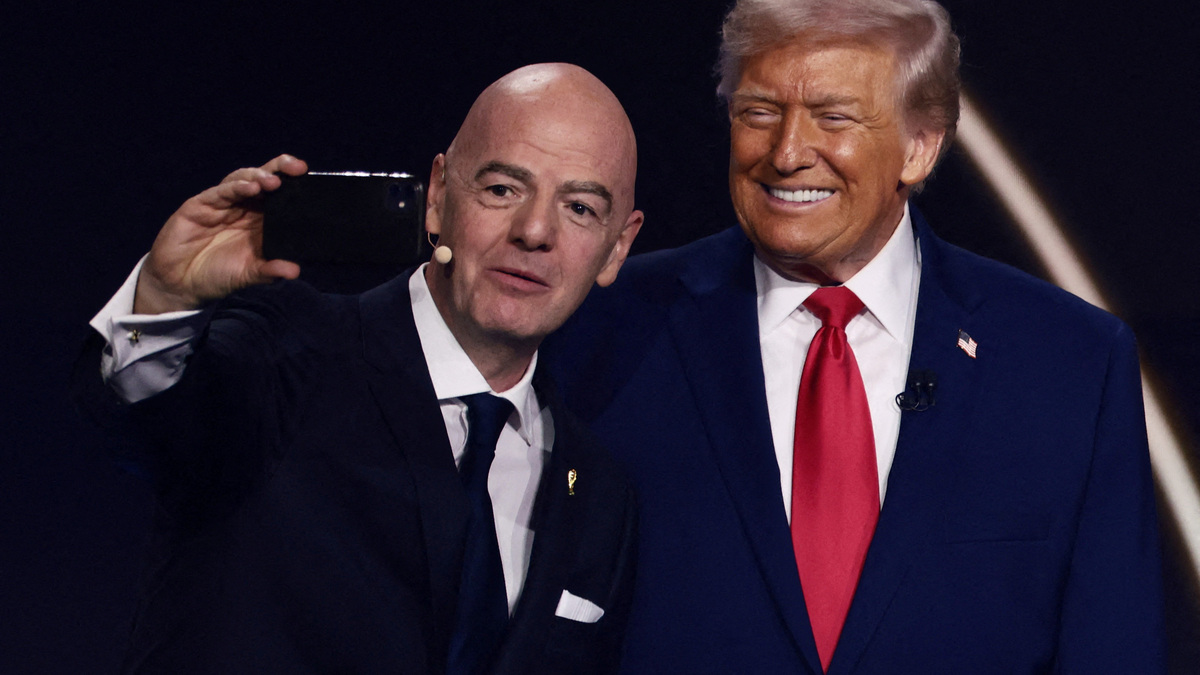 FILE PHOTO: FIFA President Gianni Infantino and U.S. President Donald Trump pose for a selfie during the FIFA World Cup 2026 Draw at the John F. Kennedy Center for the Performing Arts, Washington, D.C., U.S., December 5, 2025. REUTERS/Evelyn Hockstein/File Photo