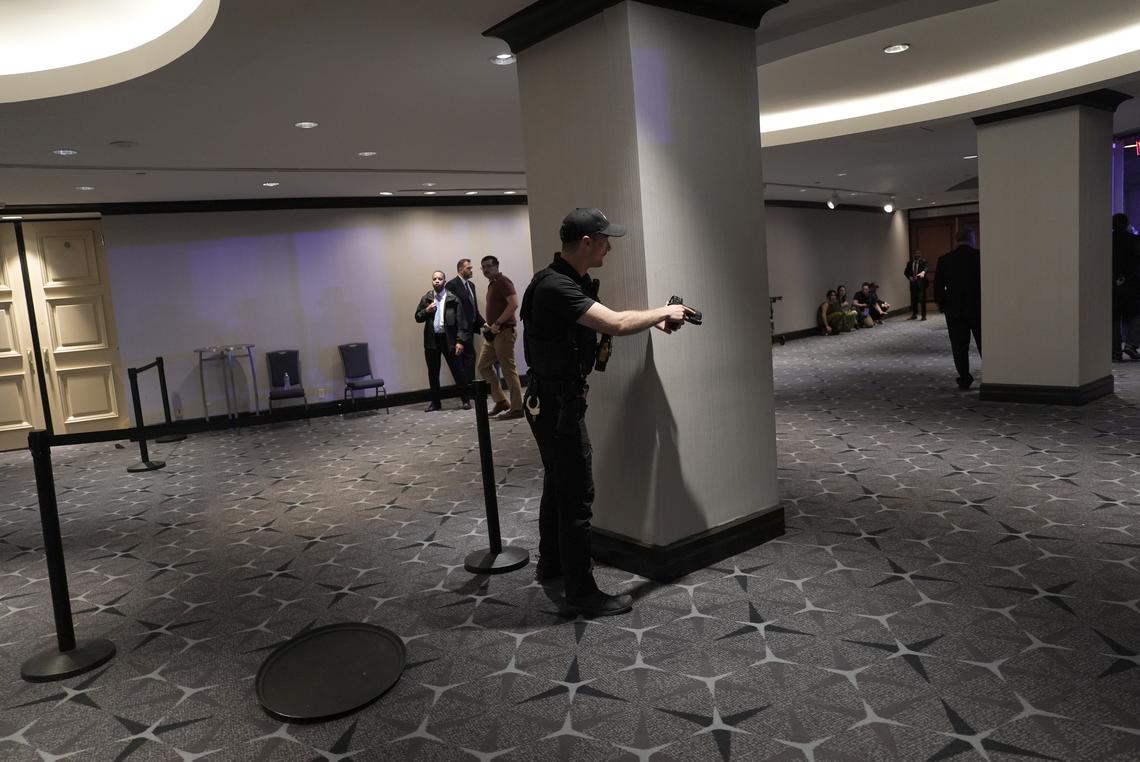 A Secret Service agent with a drawn weapon at the Washington Hilton where the White House Correspondents' Association dinner is held, in Washington on Saturday, April 25, 2026. (Salwan Georges/The New York Times)