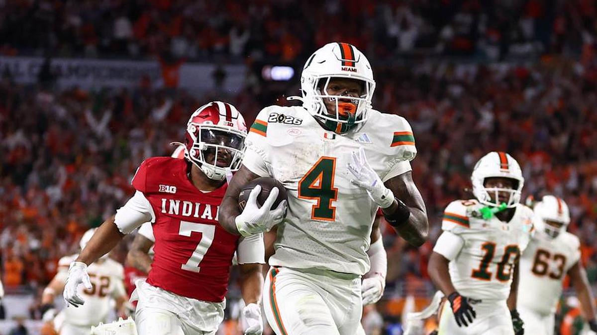  Jan 19, 2026; Miami Gardens, FL, USA; Miami Hurricanes running back Mark Fletcher Jr. (4) rushes for a touchdown past Indiana Hoosiers defensive back Louis Moore (7) in the second half during the College Football Playoff National Championship game at Hard Rock Stadium. Mandatory Credit: Mark J. Rebilas-Imagn Images | Mark J. Rebilas-Imagn Images 