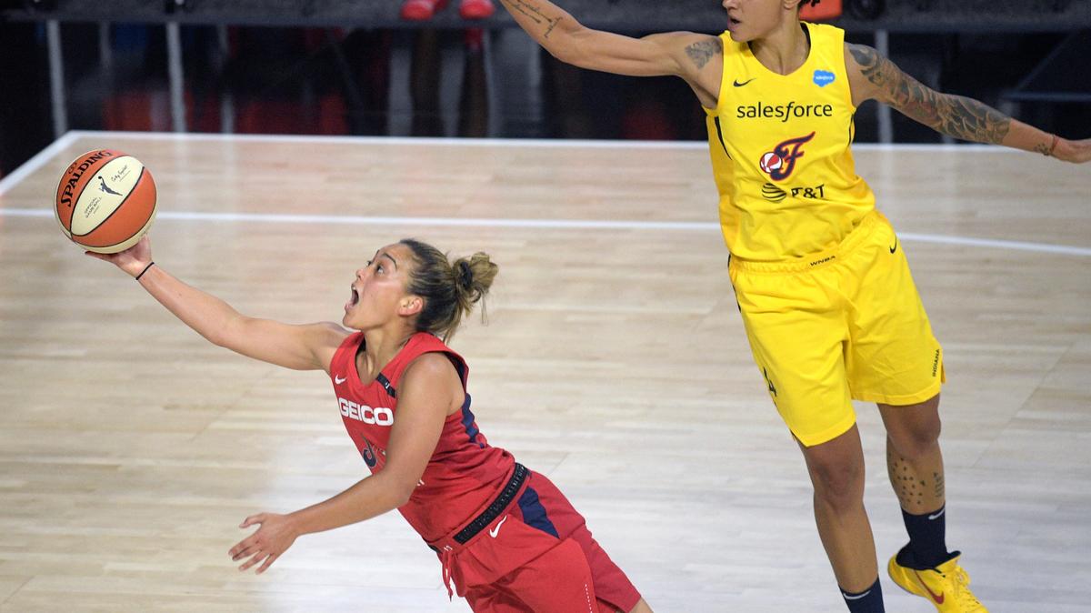 Kennewick High grad and Washington Mystics guard Leilani Mitchell, left, makes a basket after being fouled by Indiana Fever forward Candice Dupree (4) during the first half of a WNBA basketball game July 25 in Ellenton, Fla.