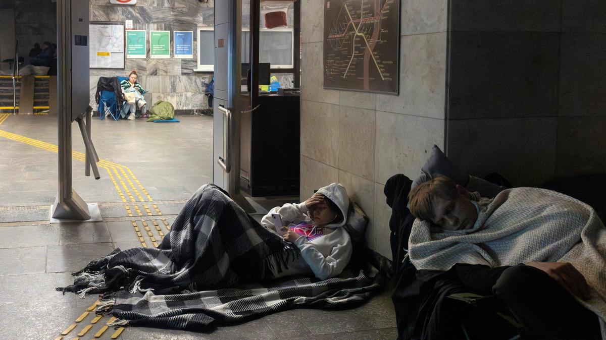 People shelter in a metro station during a Russian drone attack, amid Russia's attack on Ukraine, in Kyiv, Ukraine May 14, 2026. REUTERS/Thomas Peter