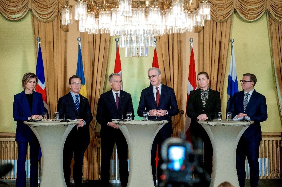 FILE PHOTO: Icelandic Prime Minister Kristrun Frostadottir, Swedish Prime Minister Ulf Kristersson, Canadian Prime Minister Mark Carney, Norwegian Prime Minister Jonas Gahr Stoere, Danish Prime Minister Mette Frederiksen and Finnish Prime Minister Petteri Orpo gather at the government's representative building in Oslo, Norway, March 15, 2026. NTB/Thomas Fure via REUTERS