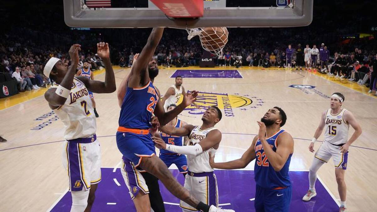  Mar 8, 2026; Los Angeles, California, USA; New York Knicks center Mitchell Robinson (23) dunks the ball against Los Angeles Lakers forward Jarred Vanderbilt (2) and forward Rui Hachimura (28) in the first half at Crypto.com Arena. Mandatory Credit: Kirby Lee-Imagn Images | Kirby Lee-Imagn Images 