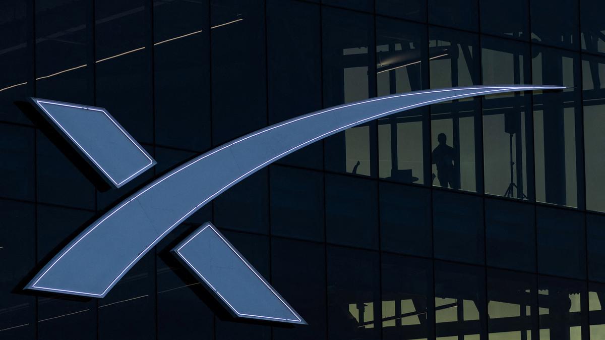 A person stands at a SpaceX corporate office, as the company prepares to file for an initial public offering (IPO), in Starbase, Texas, U.S. April 21, 2026. REUTERS/Carlos Barria
