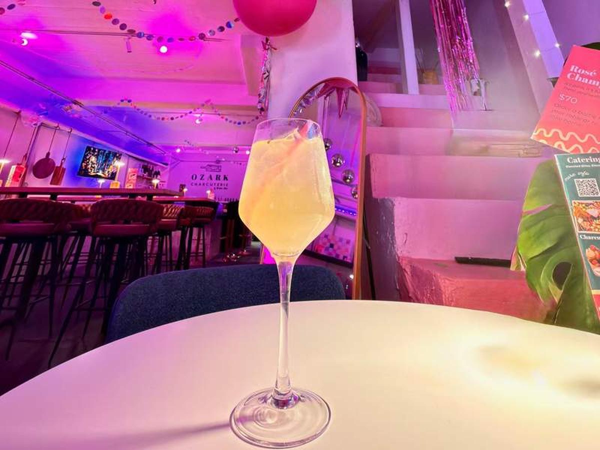  Think pink! Ozark Charcuterie & Wine Bar offers a welcoming, female-first environment that is perfect for gathering, sipping, and vibing with friends. Photo credit: Kim Orlando 