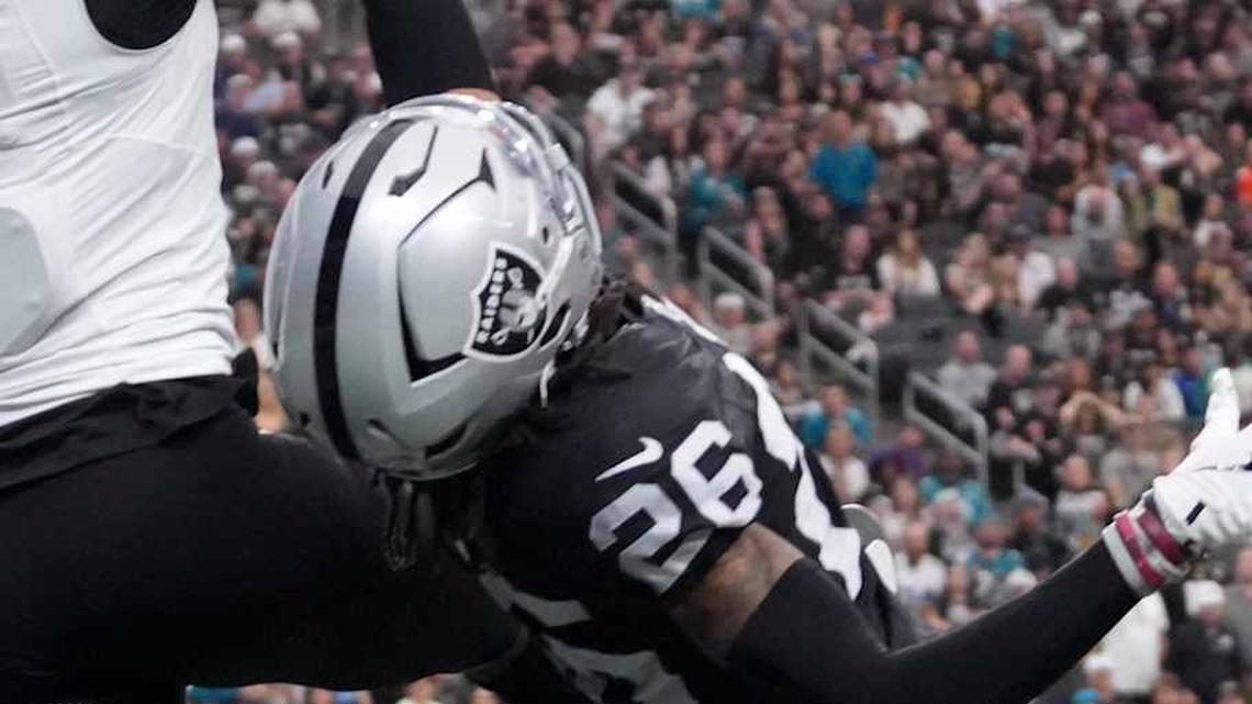  Nov 2, 2025; Paradise, Nevada, USA; Jacksonville Jaguars wide receiver Brian Thomas Jr. (7) attempts to catch the ball against Las Vegas Raiders safety Isaiah Pola-Mao (20) and cornerback Darien Porter (26) in the first half at Allegiant Stadium. Mandatory Credit: Kirby Lee-Imagn Images | Kirby Lee-Imagn Images 