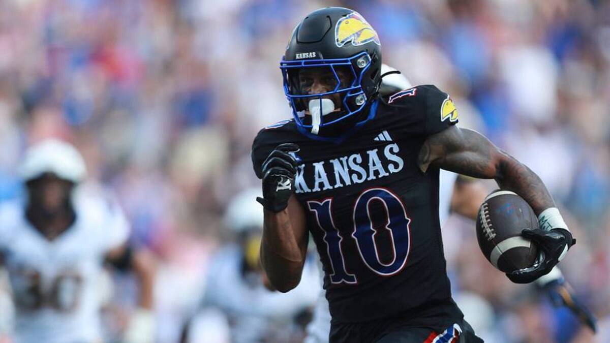  Kansas Jayhawks wide receiver Levi Wentz (10) runs the bal in for a touchdown during the first half of the game against West Virginia Mountaineers at David Booth Kansas Memorial Stadium on Sept. 20, 2025. | Evert Nelson/The Capital-Journal / USA TODAY NETWORK via Imagn Images 