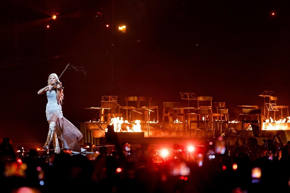 Linda Lampenius plays the violin while she and Pete Parkkonen perform “Liekinheitin,” representing Finland during the Grand Final of the 2026 Eurovision Song Contest in Vienna, Austria, May 16, 2026. REUTERS/Lisa Leutner