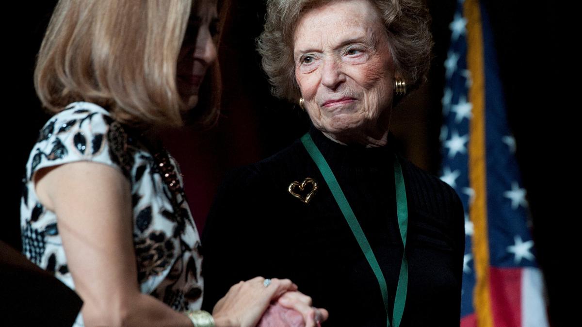 California first lady Anne Gust Brown, left, walks on the stage with Gap clothing store chain founder Doris Fisher after she was inducted, along with her late husband Donald, during the 2011 California Hall of Fame Induction Ceremony in Sacramento, California, on Dec. 8, 2011. Fisher, who with her husband founded the retail empire in 1969, remaking the apparel industry and helping to change the way Americans dress, died on May 2. She was 94.
