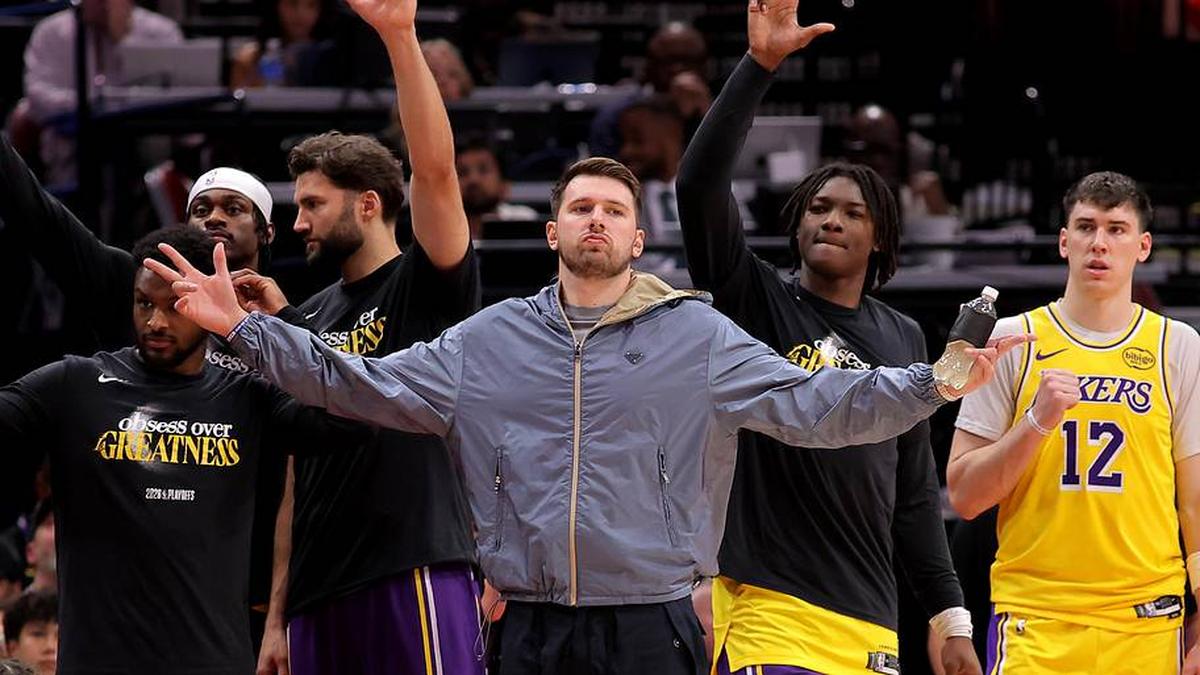  May 1, 2026; Houston, Texas, USA; Los Angeles Lakers guard Luka Doncic (77, middle) reacts after a made basket against the Houston Rockets during the fourth quarter of game six of the first round of the 2026 NBA Playoffs at Toyota Center. Mandatory Credit: Erik Williams-Imagn Images | Erik Williams-Imagn Images 