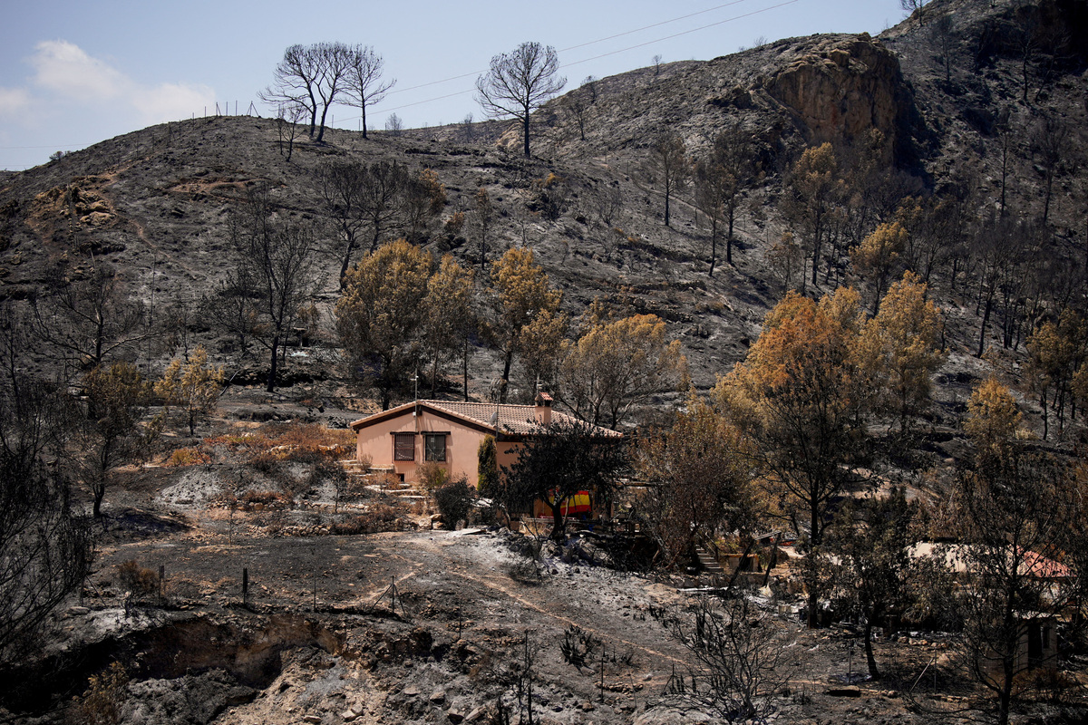 A view of a house surrounded by the aftermath of deadly wildfires in Bedar, Almeria, Spain July 13, 2026. REUTERS/Ana Beltran