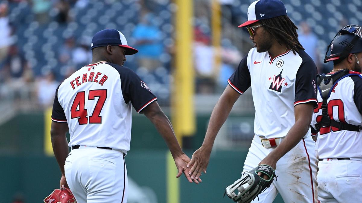 Sep 15, 2024; Washington, District of Columbia, USA; Washington Nationals relief pitcher Jose Ferrer (47) and left fielder James Wood (29) celebrate after defeating the Miami Marlins at Nationals Park. Mandatory Credit: Rafael Suanes-Imagn Images