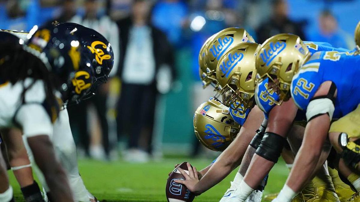  Nov 25, 2023; Pasadena, California, USA; Helmets at the line of scrimmage as UCLA Bruins long snapper Beau Gardner (60) snaps the ball against the California Golden Bears at the Rose Bowl. Mandatory Credit: Kirby Lee-Imagn Images | Kirby Lee-Imagn Images 