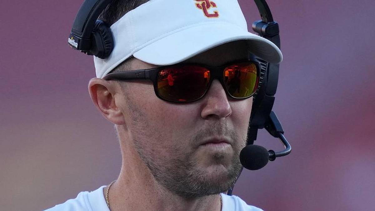  Oct 21, 2023; Los Angeles, California, USA; Southern California Trojans head coach Lincoln Riley watches from the sidelines against the Utah Utes in the first half at United Airlines Field at Los Angeles Memorial Coliseum. Mandatory Credit: Kirby Lee-Imagn Images | Kirby Lee-Imagn Images 