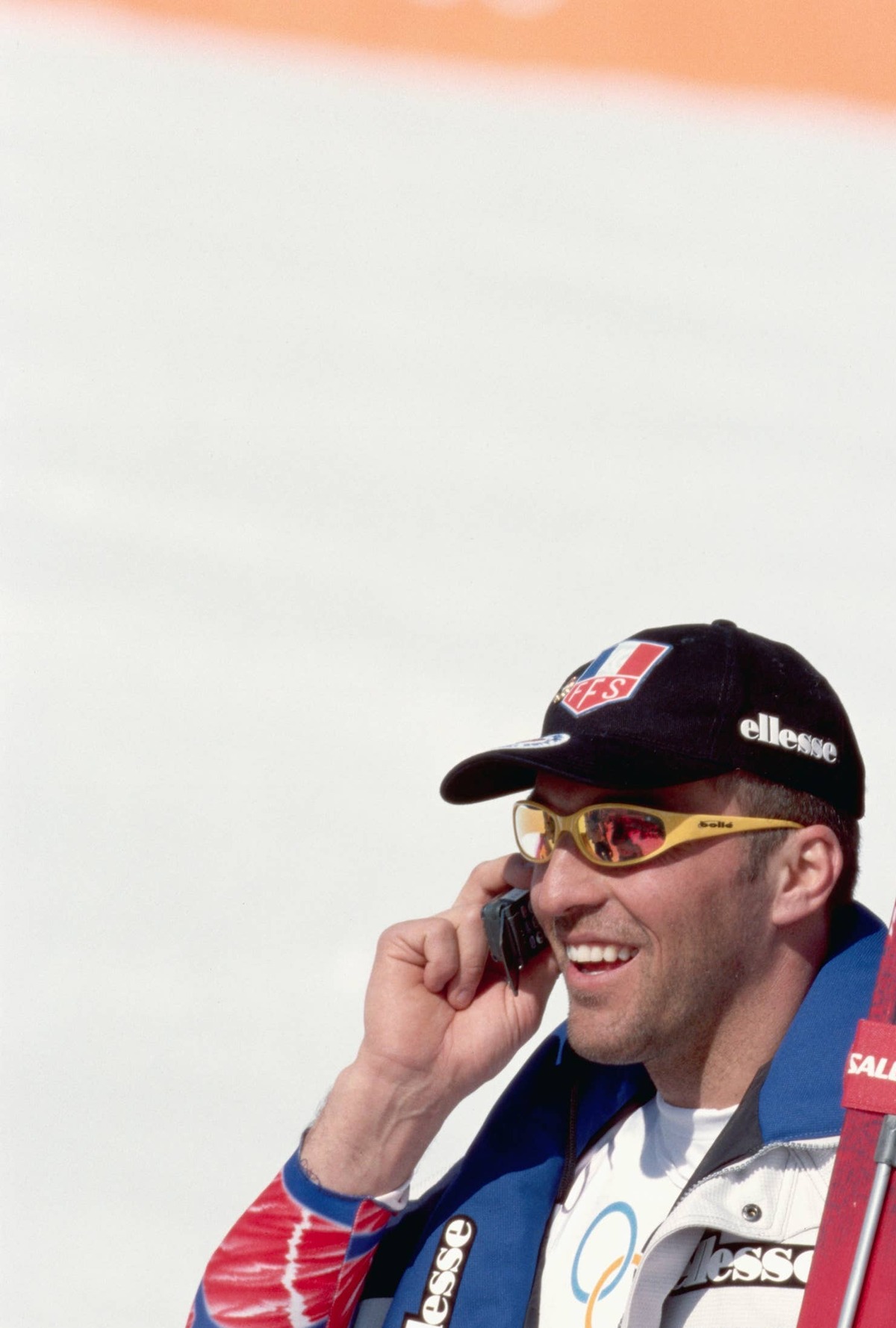  French skier Jean-Luc Cretier talks on the telephone after winning the gold medal for the men's downhill at the 1998 Winter Olympics.