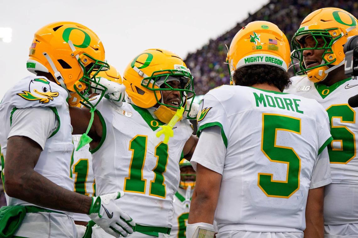  Oregon celebrates a touchdown by Oregon quarterback Dante Moore as the Oregon Ducks take on the Washington Huskies on Nov. 29, 2025, at Husky Stadium in Seattle, Washington. 