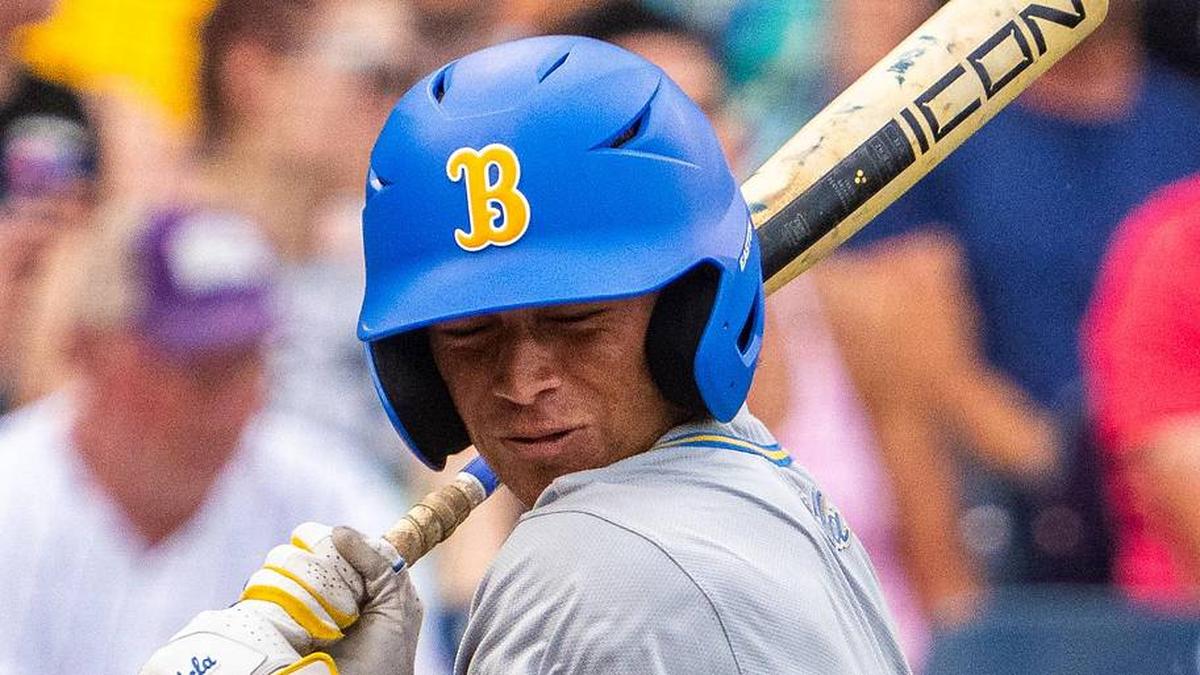  Jun 16, 2025; Omaha, Neb, USA; UCLA Bruins second baseman Phoenix Call (4) gets hit by a pitch during the second inning against the LSU Tigers at Charles Schwab Field. Mandatory Credit: Dylan Widger-Imagn Images | Dylan Widger-Imagn Images 