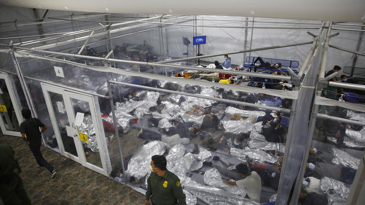 Young minors lie inside a pod at the Donna Department of Homeland Security holding facility, the main detention center for unaccompanied children in the Rio Grande Valley run by the US Customs and Border Protection, (CBP), in Donna, Texas on March 30, 2021. (Dario Lopez-Mills/Pool/AFP/Getty Images/TNS)