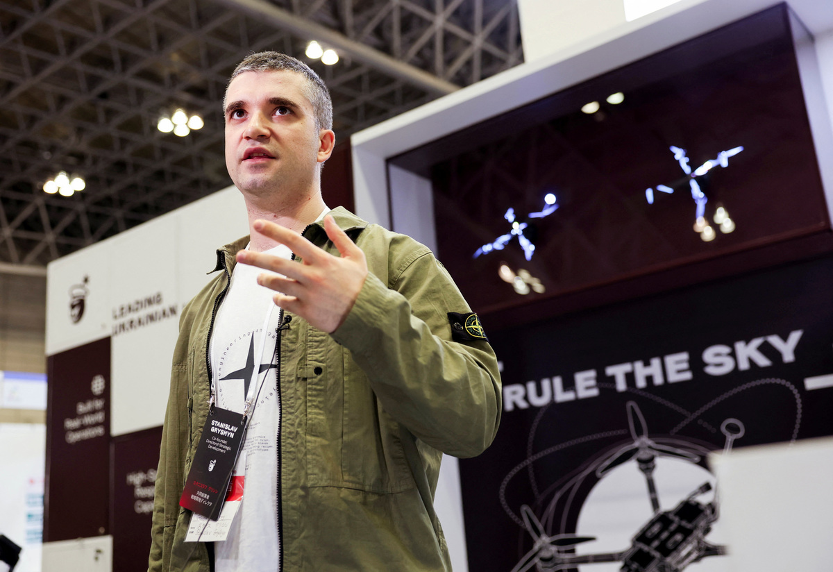 Stanislav Gryshyn, Co-Founder and Director of Strategic Development and Project Management at General Cherry, a Ukrainian drone manufacturer, responds to a reporter's question at the company booth at the Japan Drone 2026 and International Advanced Air Mobility Expo in Chiba, east of Tokyo, Japan June 5, 2026.   REUTERS/Issei Kato