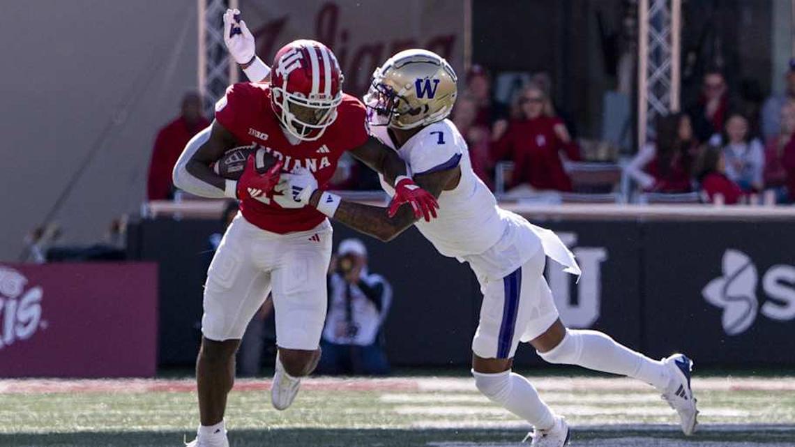  Oct 26, 2024; Bloomington, Indiana, USA; Indiana Hoosiers wide receiver Miles Cross (19) is tackled by Washington Huskies cornerback Ephesians Prysock (7) during the second quarter at Memorial Stadium. Mandatory Credit: Jacob Musselman-Imagn Images | Jacob Musselman-Imagn Images 