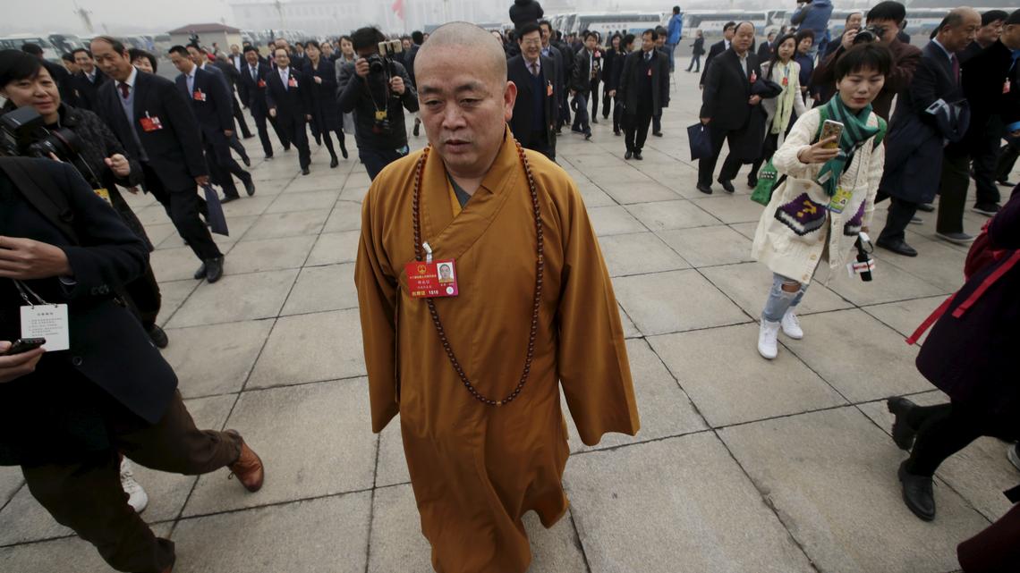 Former head of China's 'kung fu' temple sentenced to 24 years, state media reports 
