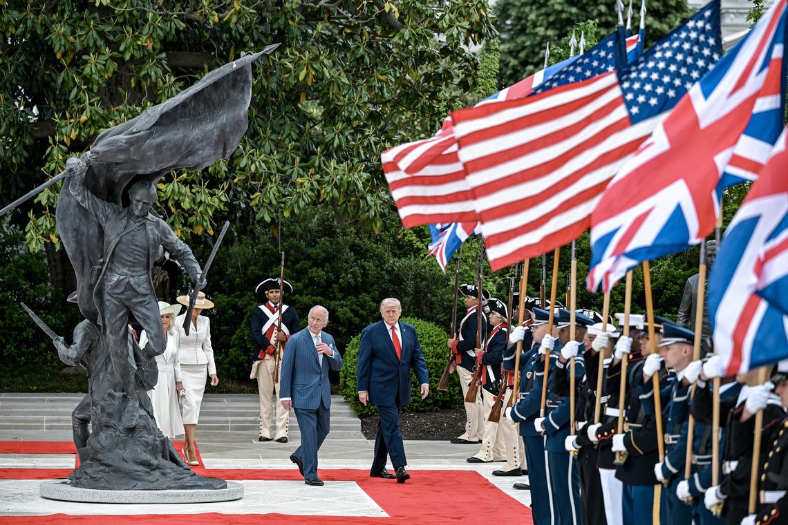 King Charles III looks up at the statue "Freedom's Charge" by sculptor Chas Fagan as he walks with President Donald Trump through the Rose Garden during an arrival ceremony at the White House in Washington, on Tuesday, April 28, 2026. (Kenny Holston/The New York Times)