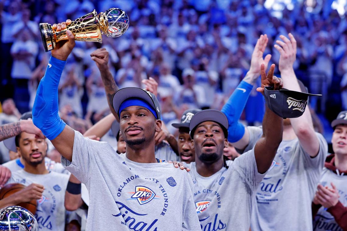  Oklahoma City Thunder guard Shai Gilgeous-Alexander celebrates with Magic Johnson West Conference Finals MVP trophy after defeating the Minnesota Timberwolves in game five to win the western conference finals for the 2025 NBA Playoffs. Alonzo Adams-Imagn Images