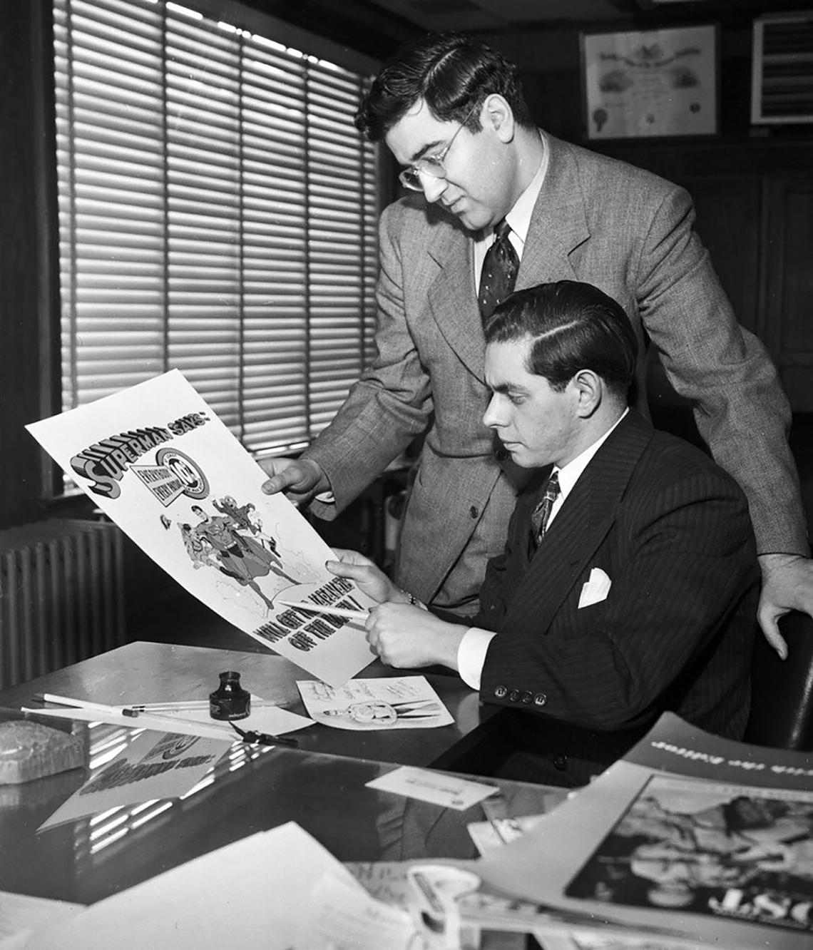 Jerry Siegel and Joe Shuster with a piece of Superman art.Courtesy William Bernhardt
