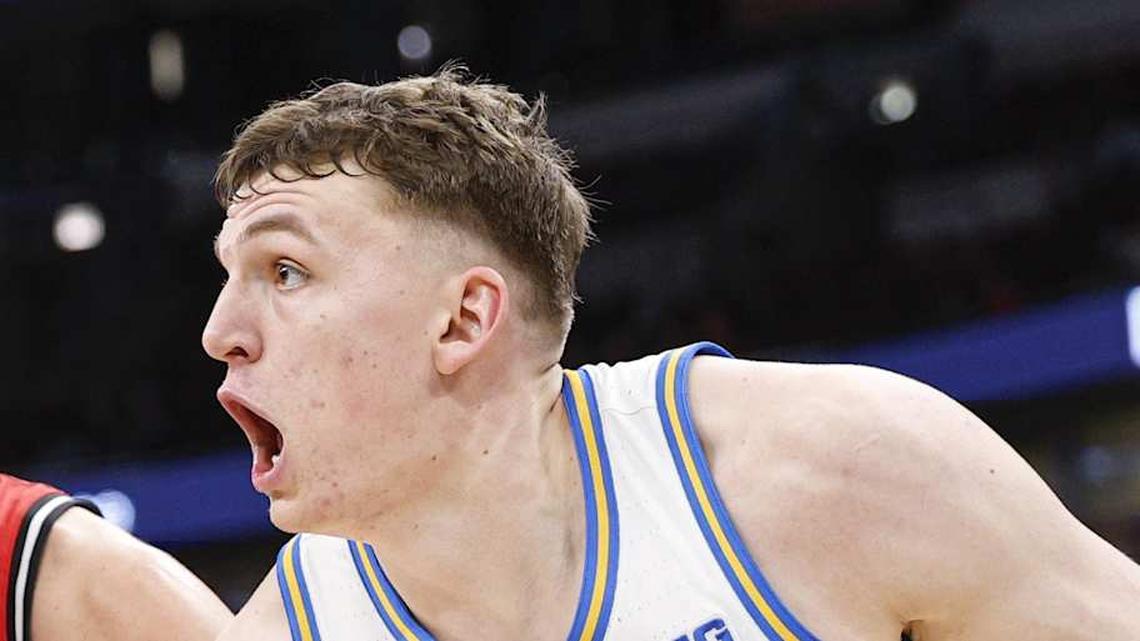  Mar 12, 2026; Chicago, IL, USA; UCLA Bruins forward Tyler Bilodeau (34) drives to the basket against Rutgers Scarlet Knights guard Harun Zrno (13) during the second half at United Center. Mandatory Credit: Kamil Krzaczynski-Imagn Images | Kamil Krzaczynski-Imagn Images 
