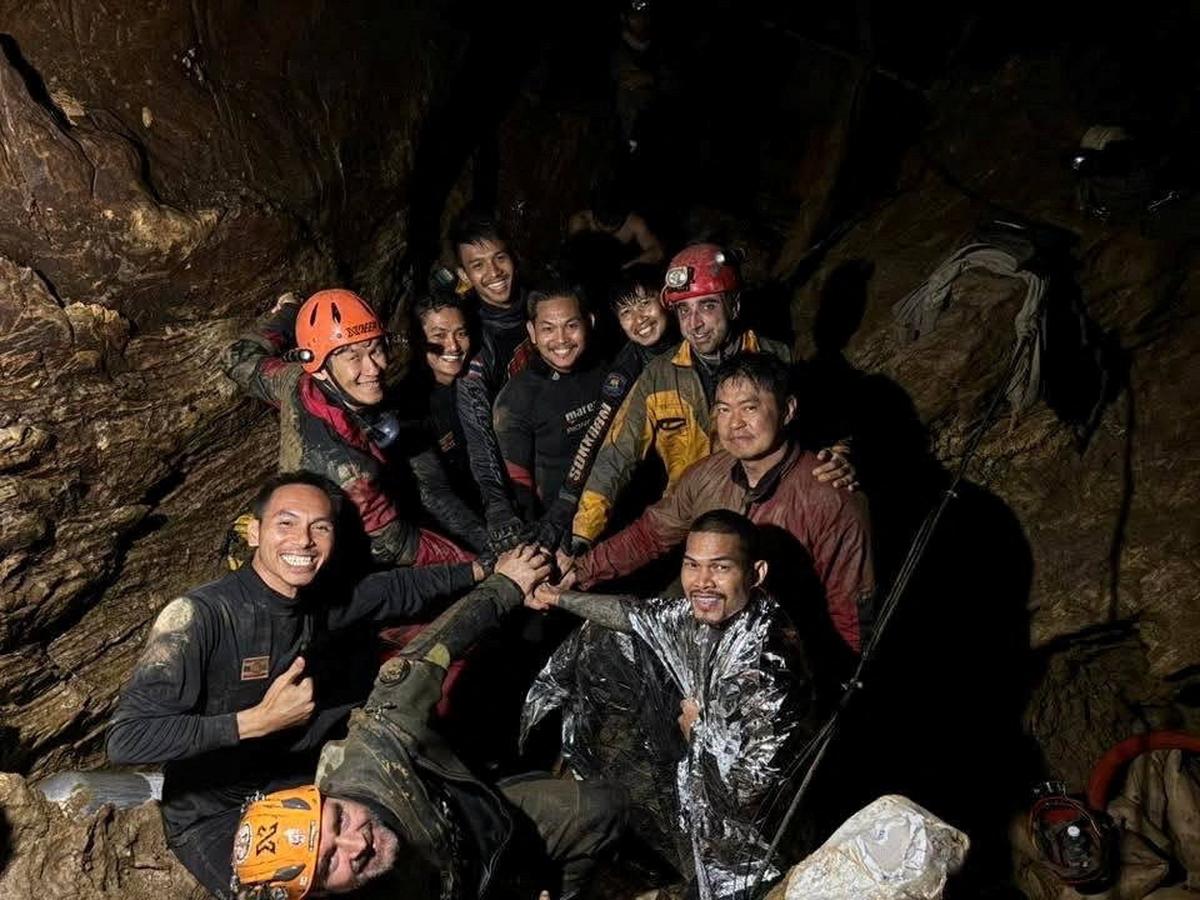 Rescuers pose for a photo as they work to save trapped people in a cave in Xaisomboun Province, Laos, May 29, 2026. METTA THAM KALASIN RESCUE /Handout via REUTERS