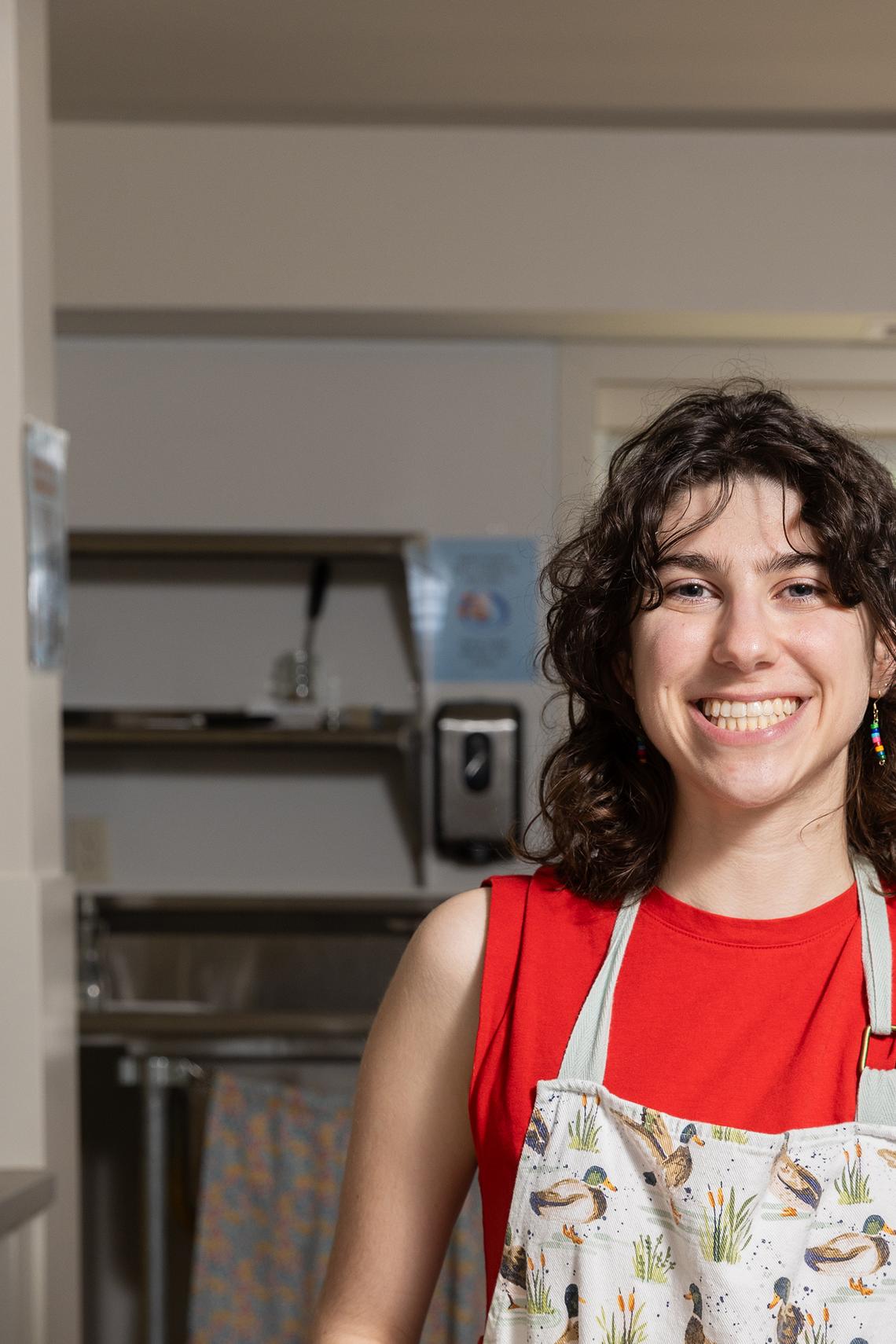 Annie Rogovin, a junior, with a batch of cookies at the Dacie Moses House, Carleton College's cookie house in Northfield, Minn., March 30, 2026. For decades, Carleton College has kept a place where students and others can come, bake and share. (Liam James Doyle/The New York Times)
