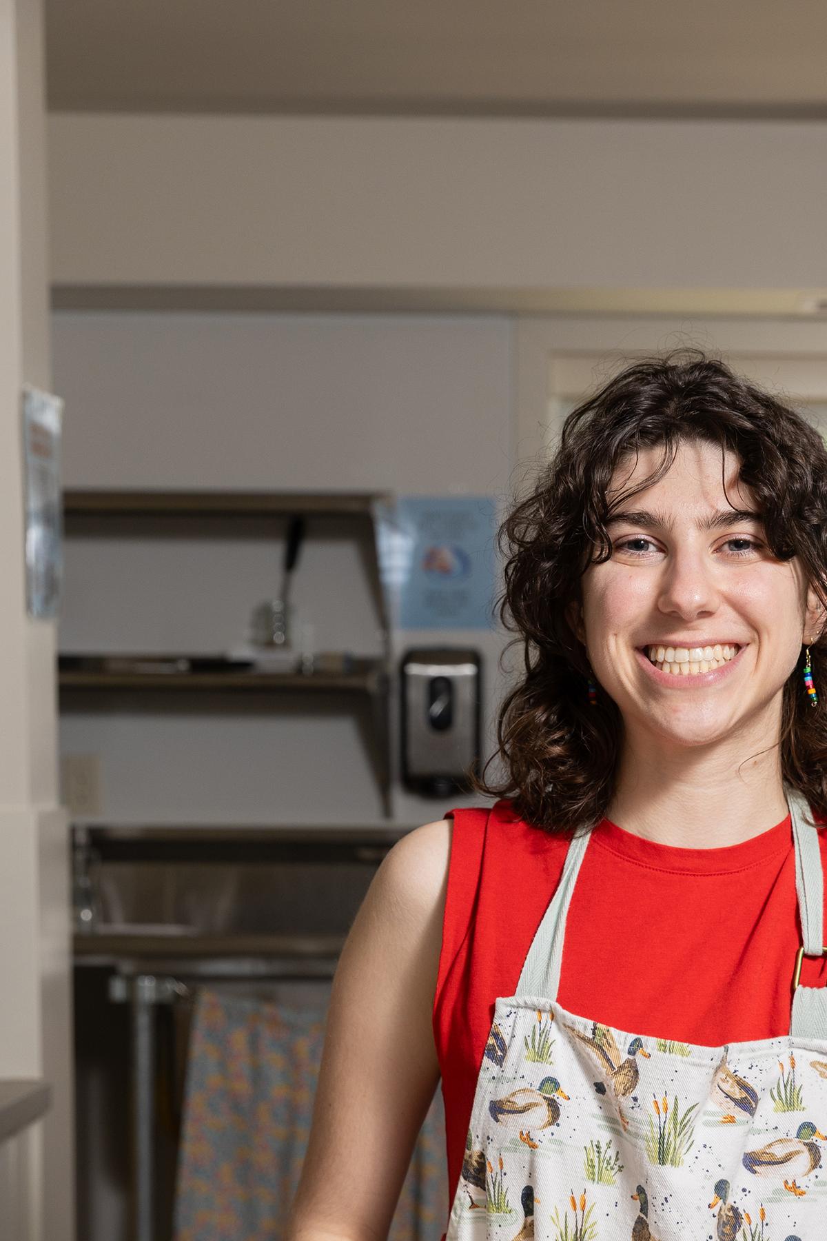 Annie Rogovin, a junior, with a batch of cookies at the Dacie Moses House, Carleton College's cookie house in Northfield, Minn., March 30, 2026. For decades, Carleton College has kept a place where students and others can come, bake and share. (Liam James Doyle/The New York Times)