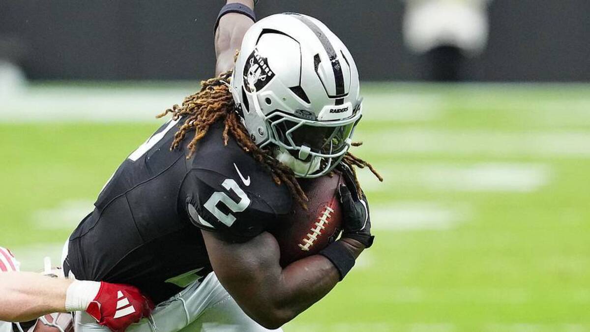  Aug 16, 2025; Paradise, Nevada, USA; Raiders running back Ashton Jeanty (2) evades the tackle attempt of San Francisco 49ers linebacker Luke Gifford (57) during the first quarter at Allegiant Stadium. Mandatory Credit: Stephen R. Sylvanie-Imagn Images | Stephen R. Sylvanie-Imagn Images 