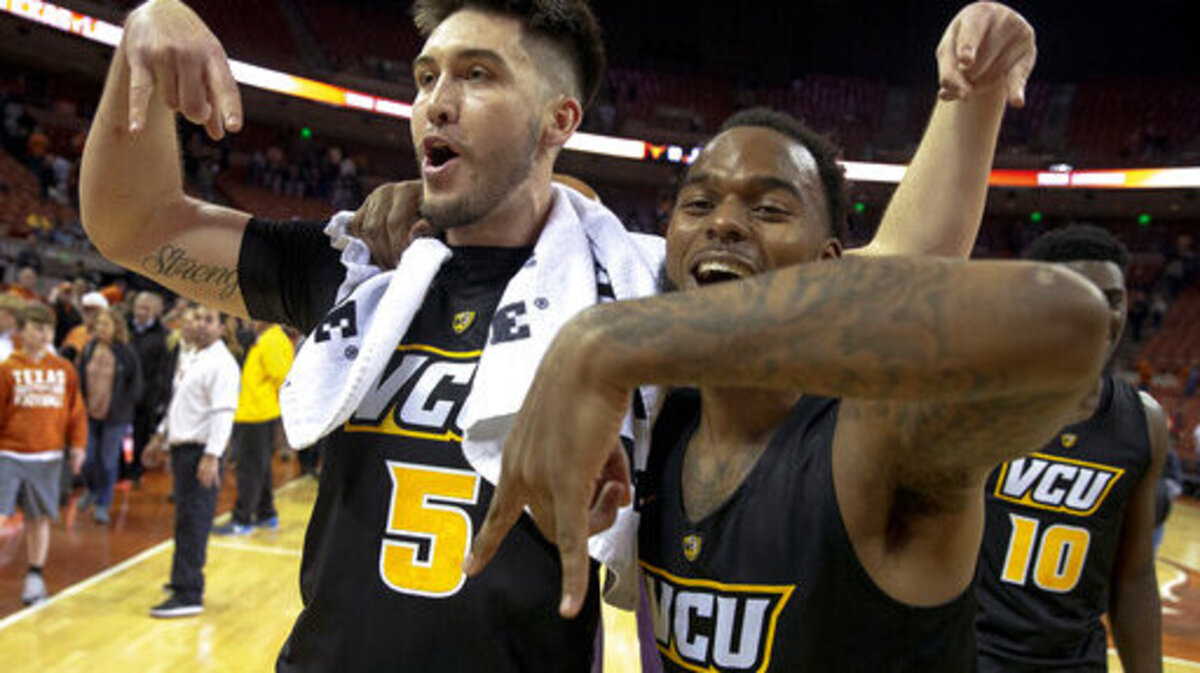 FILE - In this Wednesday, Dec. 5, 2018, file photo, Virginia Commonwealth forward Sean Mobley (5) and guard Mike’L Simms (1) throw the “Hook ‘Em Horns” sign down after defeating Texas 54-53 in an NCAA college basketball game in Austin, Texas. The Rams have 25 wins and are the top seed in the Atlantic 10 men’s basketball tournament.